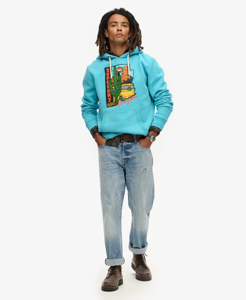 bluza z kapturem z grafiką pocztówki podróżnej w kolorze maui blue