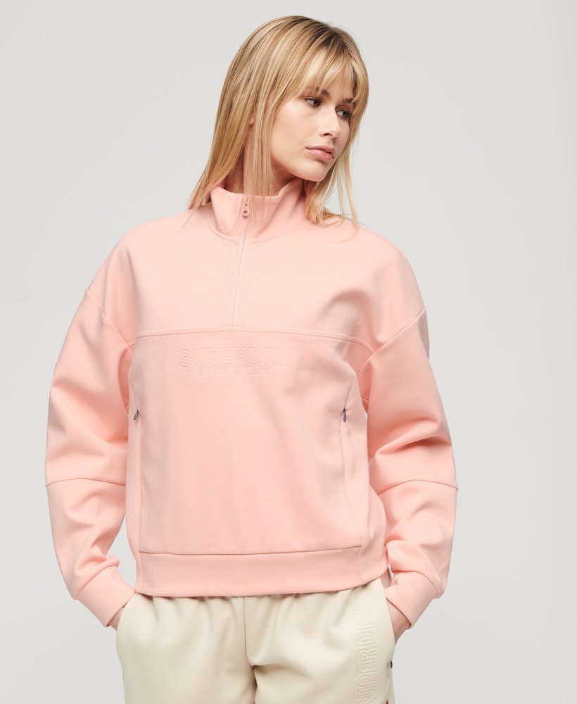 sport tech relaxed half zip w kolorze brzoskwiniowo-różowym