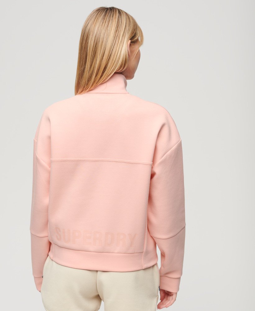 sport tech relaxed half zip w kolorze brzoskwiniowo-różowym