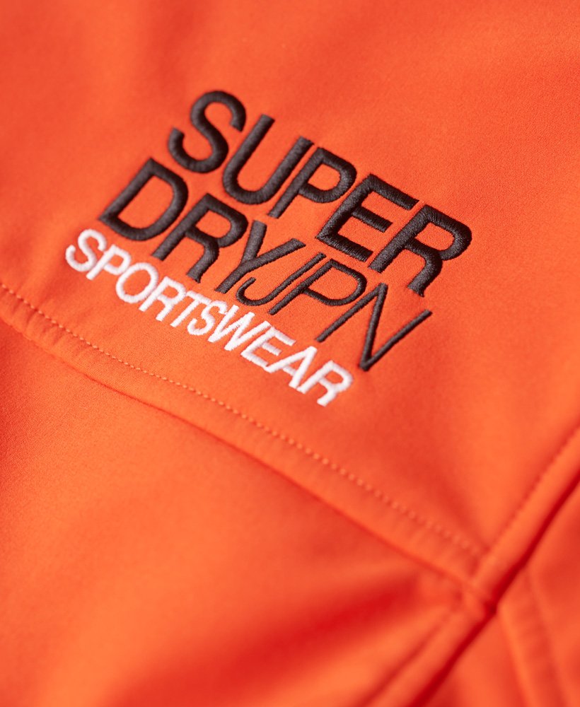 kurtka typu softshell z kapturem i podszewką z polaru w intensywnym pomarańczowym kolorze