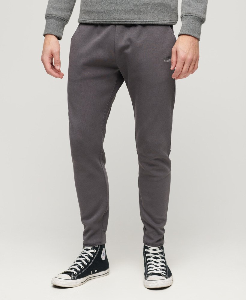 spodnie dresowe sport tech tapered w kolorze ciemnoszarym