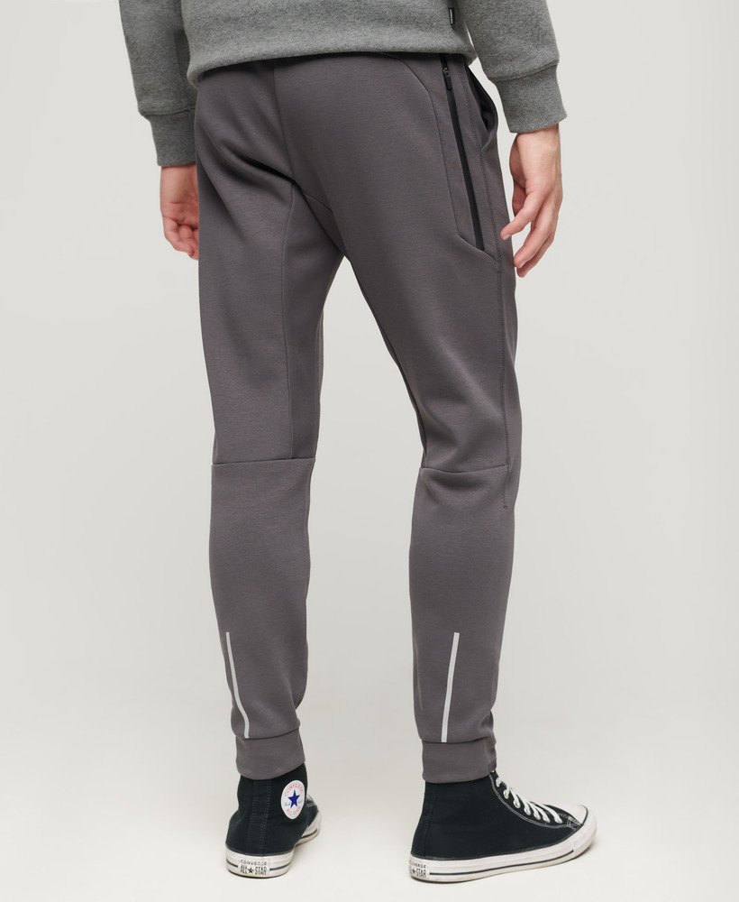 spodnie dresowe sport tech tapered w kolorze ciemnoszarym