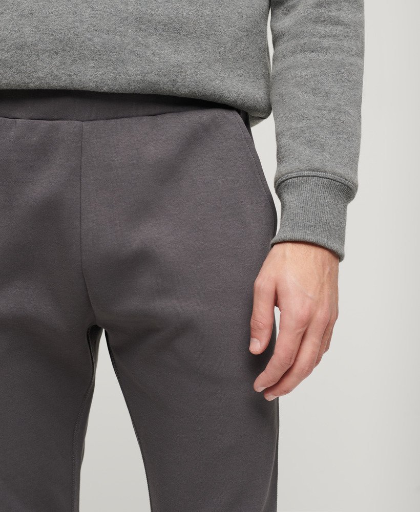 spodnie dresowe sport tech tapered w kolorze ciemnoszarym
