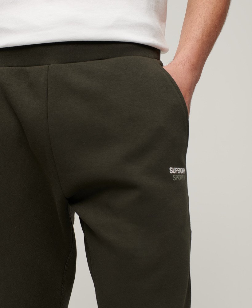 spodnie dresowe sport tech tapered w kolorze army khaki