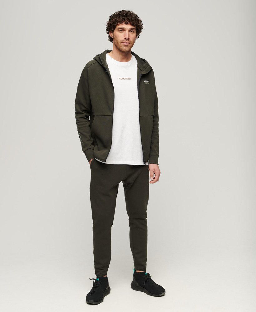 spodnie dresowe sport tech tapered w kolorze army khaki