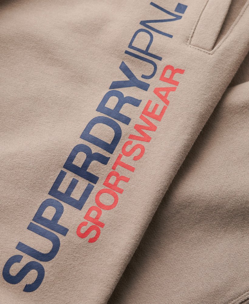 spodnie dresowe sportswear z logo zwężanym dołem w kolorze głębokiego beżu slub