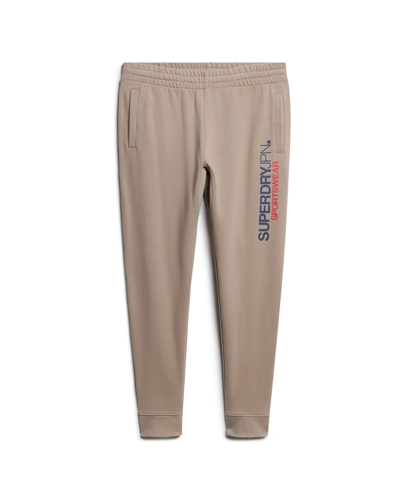 spodnie dresowe sportswear z logo zwężanym dołem w kolorze głębokiego beżu slub