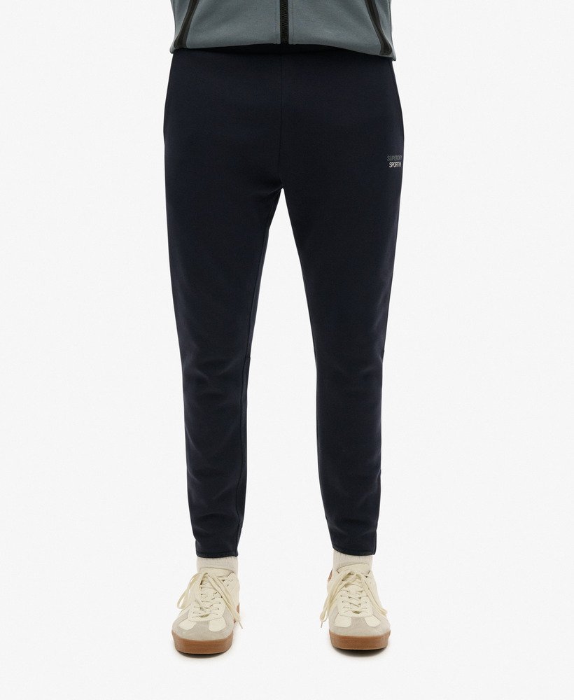 spodnie dresowe sport tech logo tapered joggers w kolorze eclipse navy