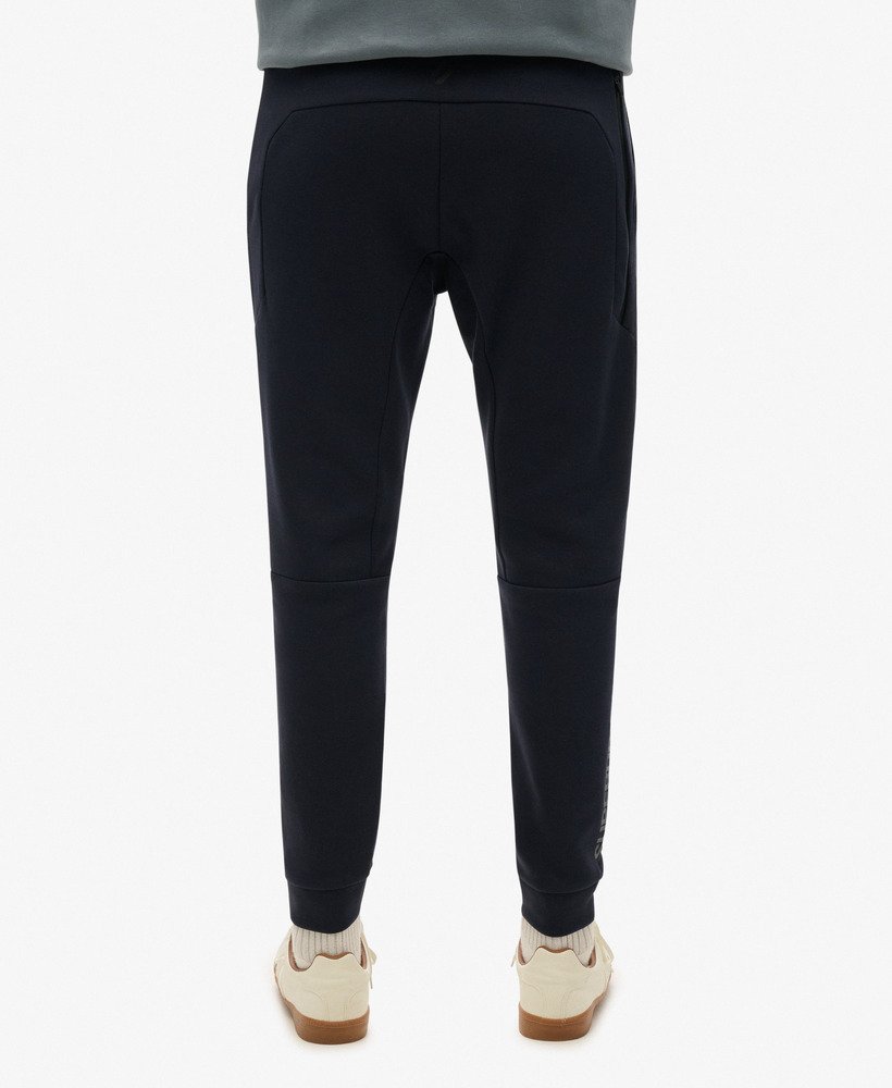 spodnie dresowe sport tech logo tapered joggers w kolorze eclipse navy