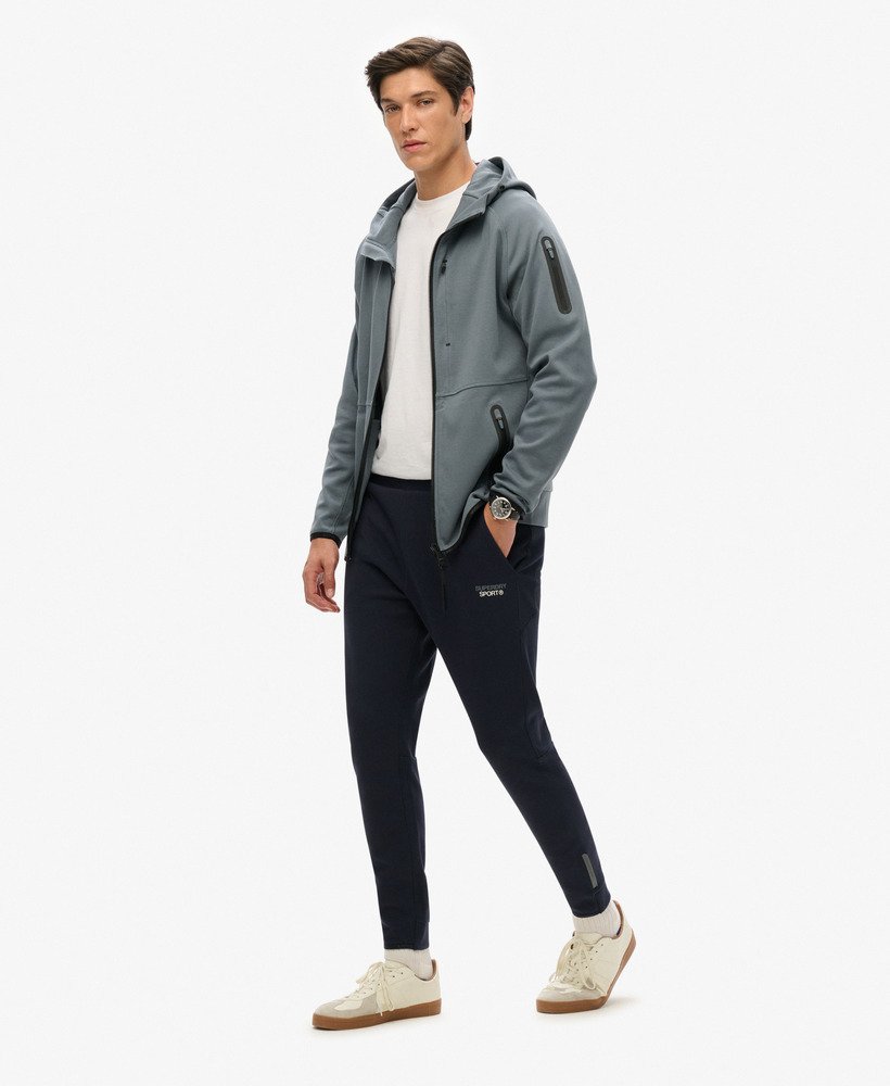 spodnie dresowe sport tech logo tapered joggers w kolorze eclipse navy