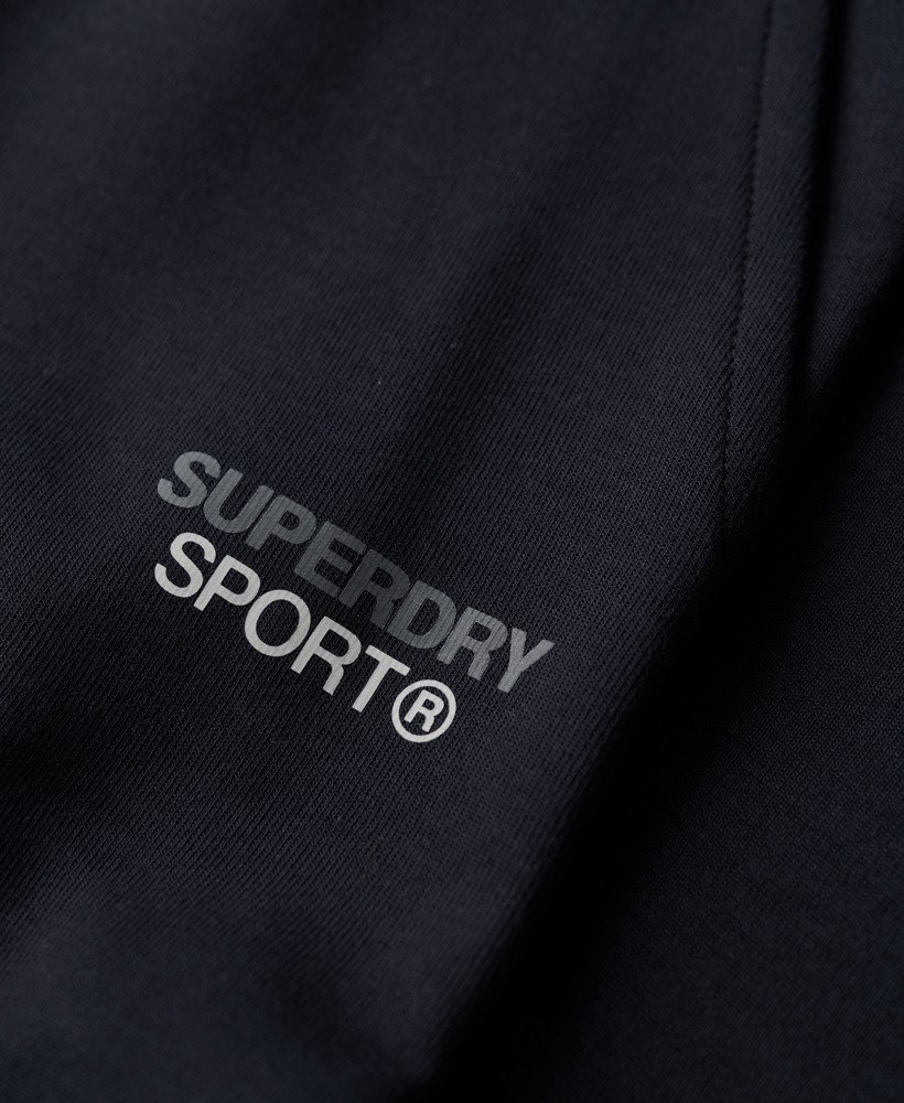 spodnie dresowe sport tech logo tapered joggers w kolorze eclipse navy