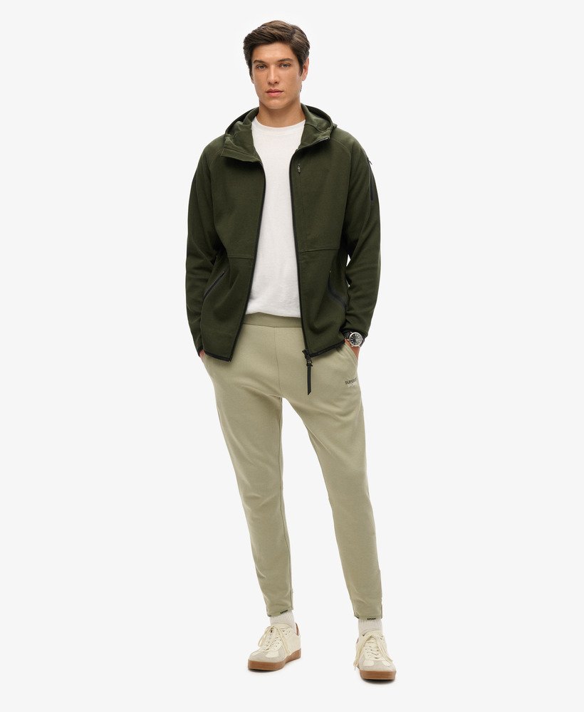 spodnie dresowe sport tech logo tapered w kolorze trawy morskiej