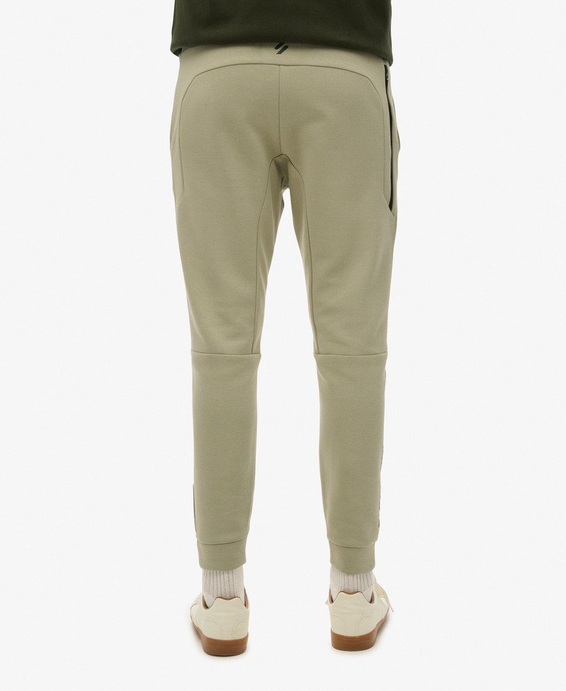 spodnie dresowe sport tech logo tapered w kolorze trawy morskiej