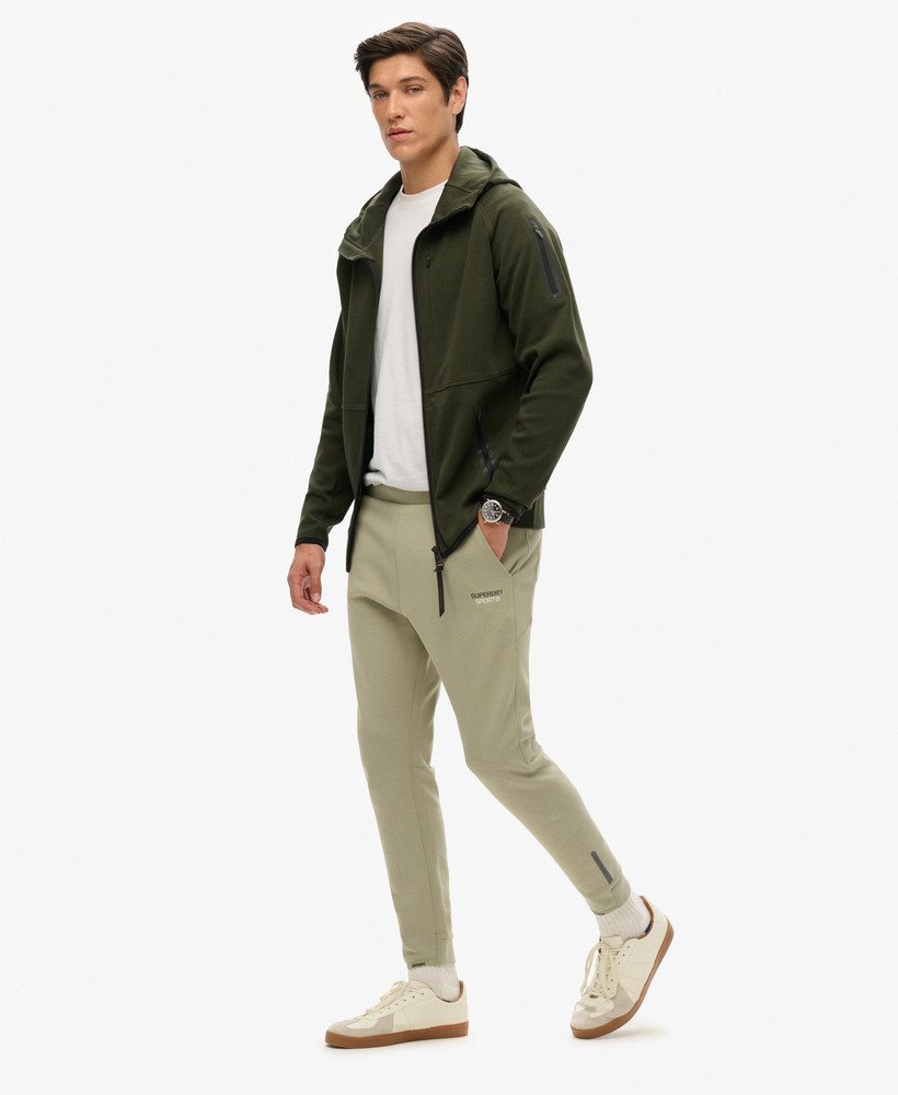 spodnie dresowe sport tech logo tapered w kolorze trawy morskiej