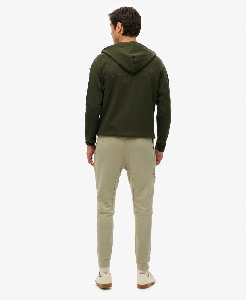 spodnie dresowe sport tech logo tapered w kolorze trawy morskiej