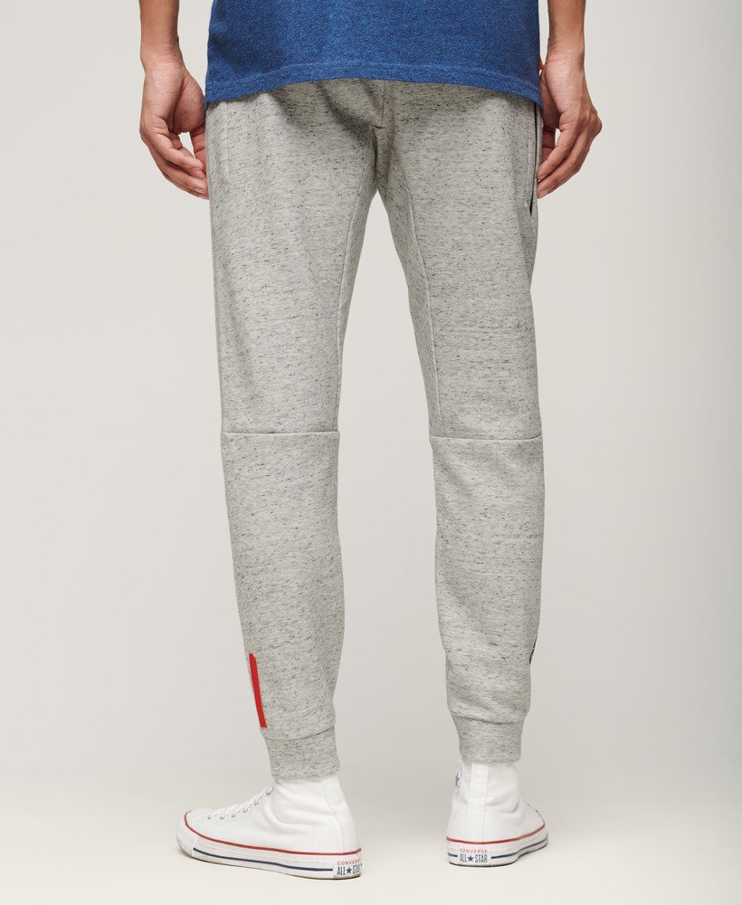 spodnie dresowe sport tech logo tapered w kolorze athletic grey marl