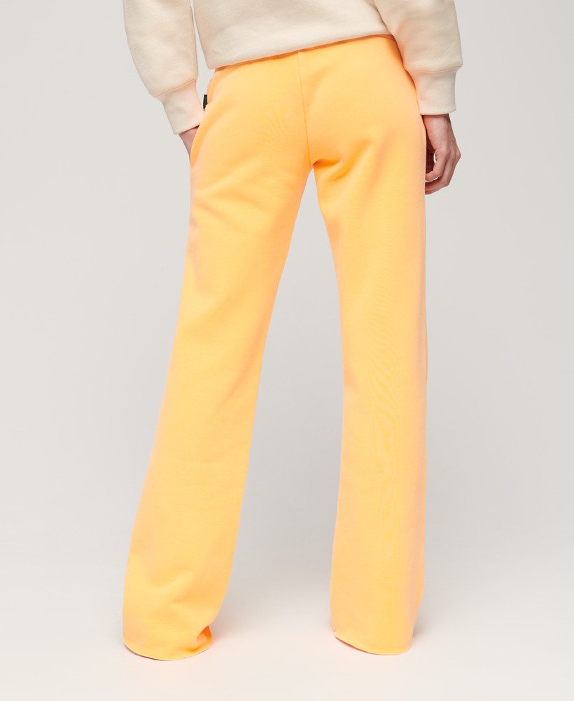 spodnie dresowe neon vintage z niskim stanem i rozszerzanymi nogawkami w kolorze pop orange
