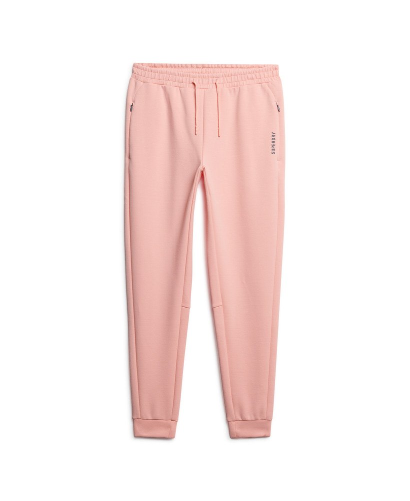 spodnie dresowe sports tech slim joggers w kolorze brzoskwiniowo-perłowym