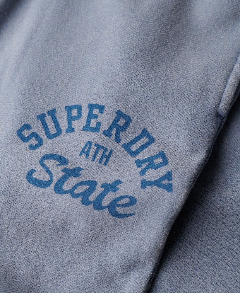 spodnie dresowe athletic essentials vintage washed graphic w kolorze tidal blue