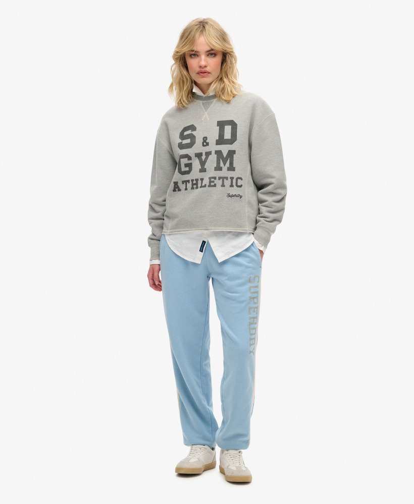 spodnie dresowe athletic essentials vintage side stripe w kolorze allure blue