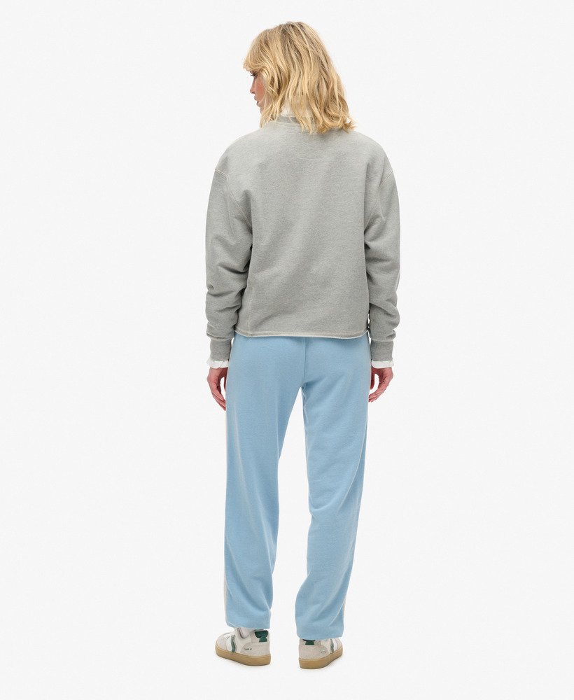 spodnie dresowe athletic essentials vintage side stripe w kolorze allure blue