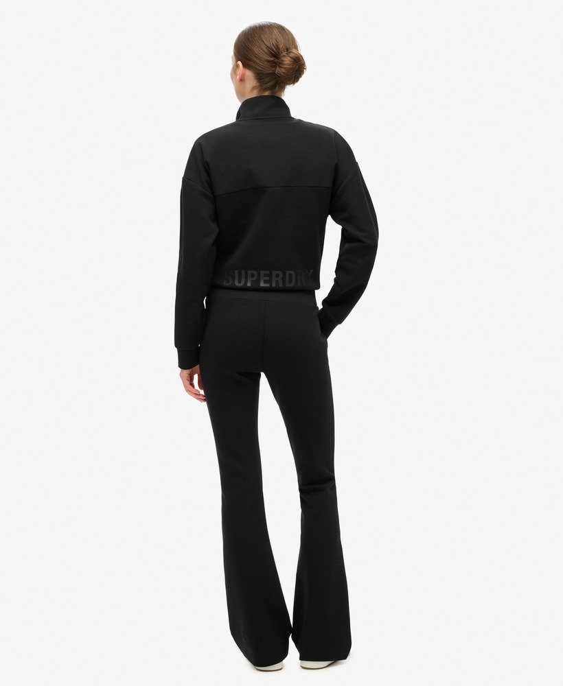 spodnie dresowe sport tech low rise flared w kolorze czarnym