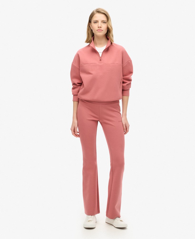 spodnie dresowe sport tech low rise flared w kolorze withered rose