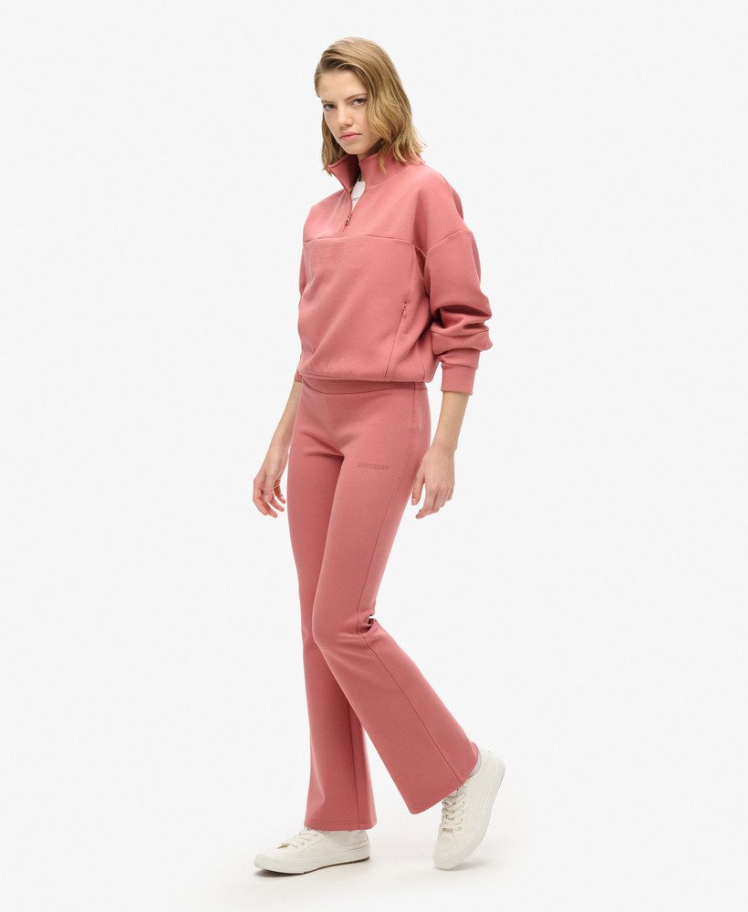 spodnie dresowe sport tech low rise flared w kolorze withered rose