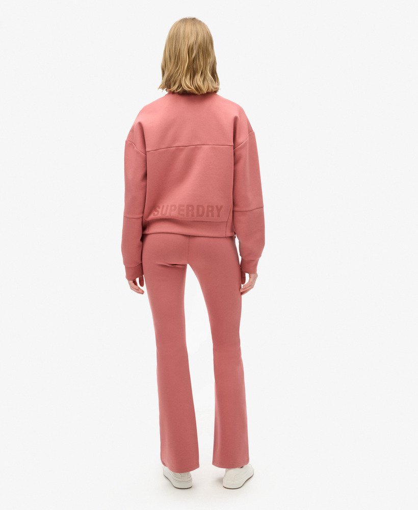 spodnie dresowe sport tech low rise flared w kolorze withered rose