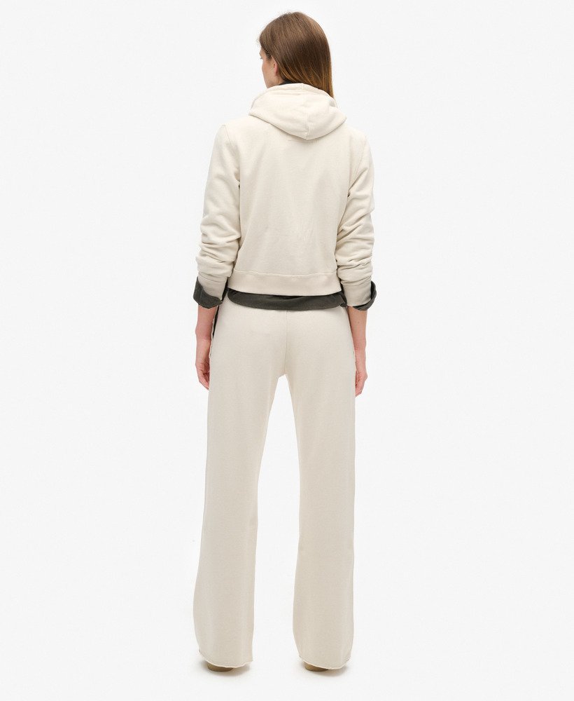 spodnie dresowe athletic essentials low rise flare w kolorze turtledove cream