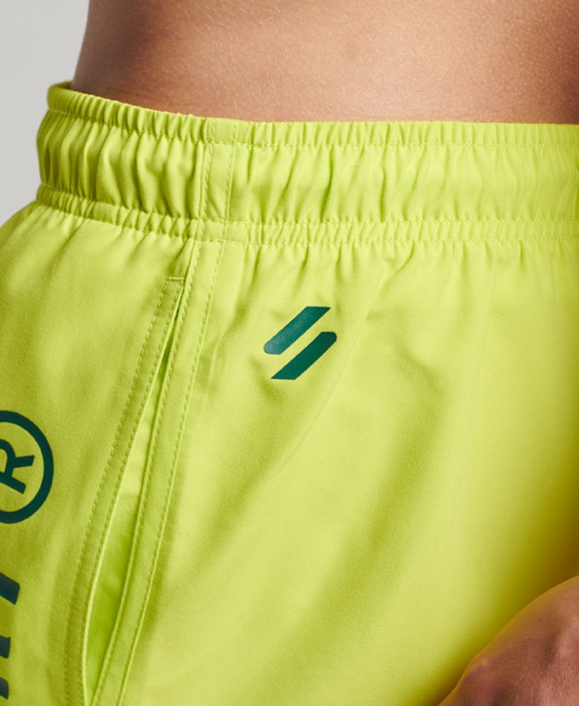 spodenki kąpielowe core sport 17 cali z recyklingu w kolorze limonkowym
