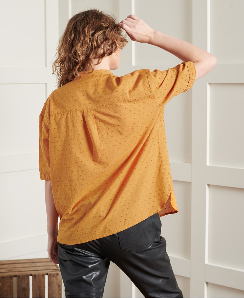 bluzka z kołnierzykiem dry henley w limitowanej edycji o fakturze kurkumy