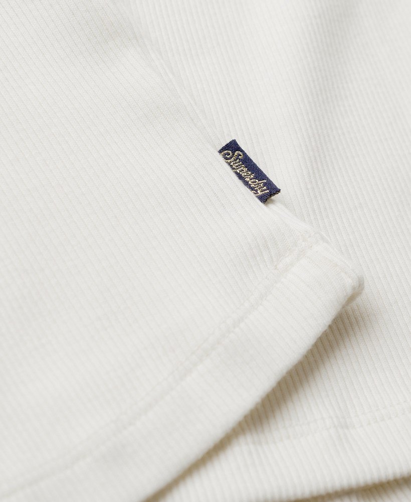 koszulka bez rękawów athletic essentials zapinana na guziki w kolorze off white